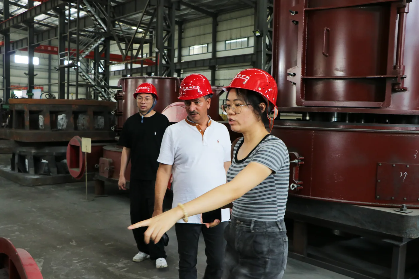 Indian customer inspecting grinding mill equipment in the CRONUS factory